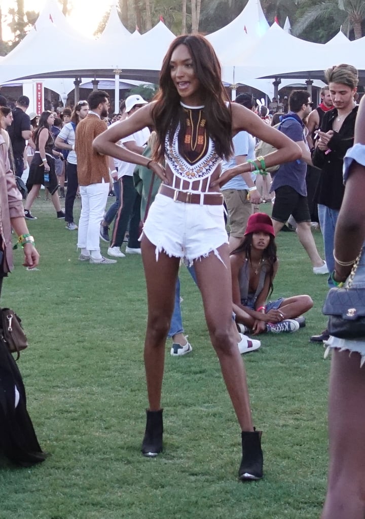 Jourdan Dunn's white shorts got the festival treatment with a crop top and walkable boots.