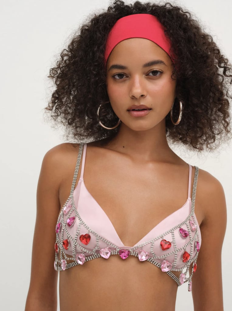 For Love & Lemons Rhinestone Heart Bralette ($224, originally $298)
While it may not make for the type of street style trend you wear for the rest of the year, a midriff-baring top like this embellished bralette is a perfection choice for festival season, especially when paired with cargo pants or oversize jeans.