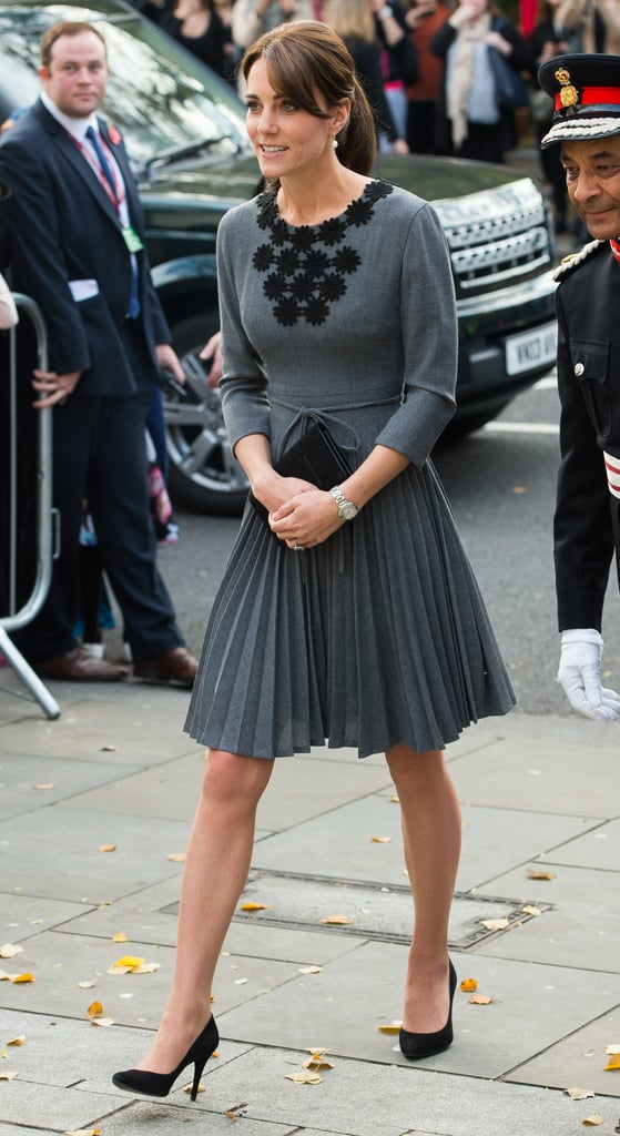 Kate completed her sophisticated look with black functional pumps.