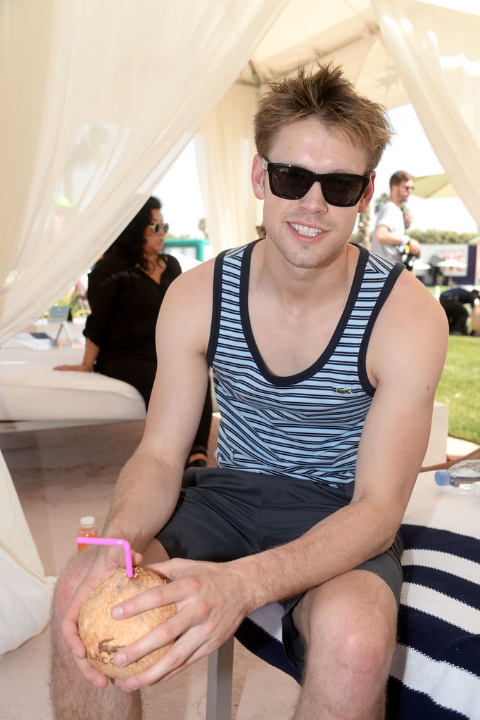 Chord Overstreet sipped on a tropical drink.