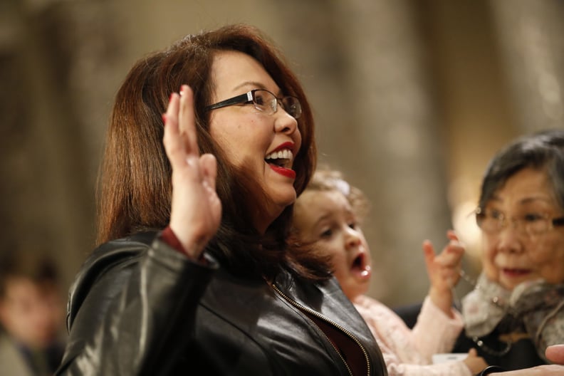 WASHINGTON, DC - JANUARY 3: U.S. Sen. Tammy Duckworth (D-IL) participates in a reenacted swearing-in with U.S. Vice President Joe Biden in the Old Senate Chamber at the U.S. Capitol January 3, 2017 in Washington, DC. Earlier in the day Biden swore in the 