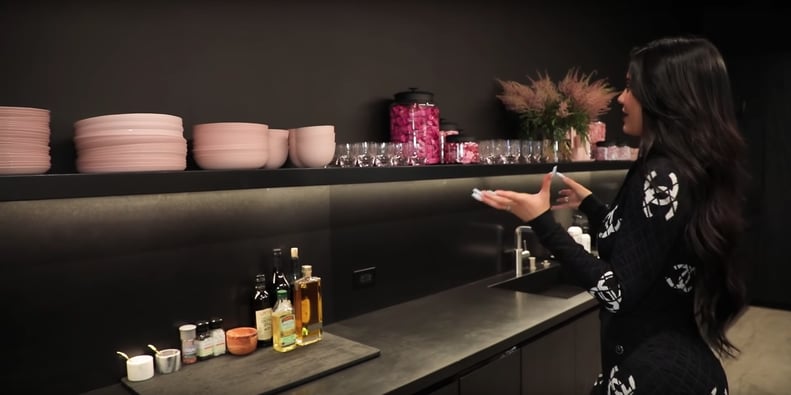 Pink Accents Make the Black Kitchen Surfaces Really Pop