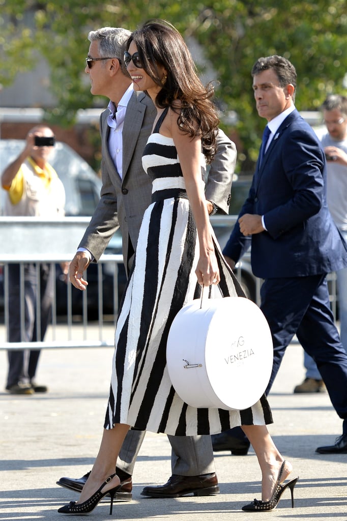 On the eve of the wedding in 2014, Amal was spotted in a black-and-white striped dress and a pair of classic slingback heels.