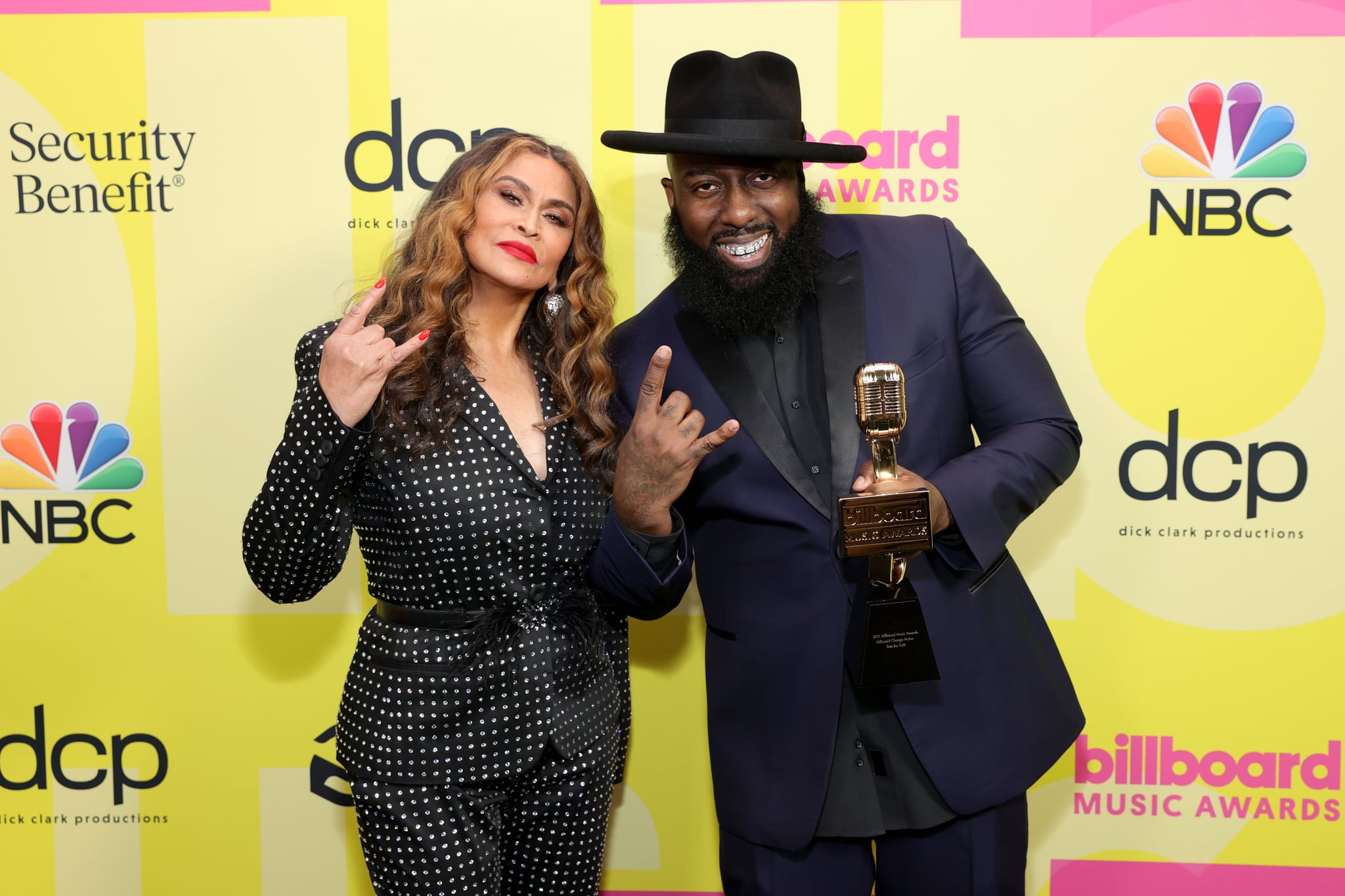 LOS ANGELES, CALIFORNIA - MAY 23: (L-R) Tina Knowles-Lawson and Trae tha Truth, winner of the Billboard Change Maker Award, pose backstage for the 2021 Billboard Music Awards, broadcast on May 23, 2021 at Microsoft Theatre in Los Angeles, California. (Photo by Rich Fury/Getty Images for dcp)