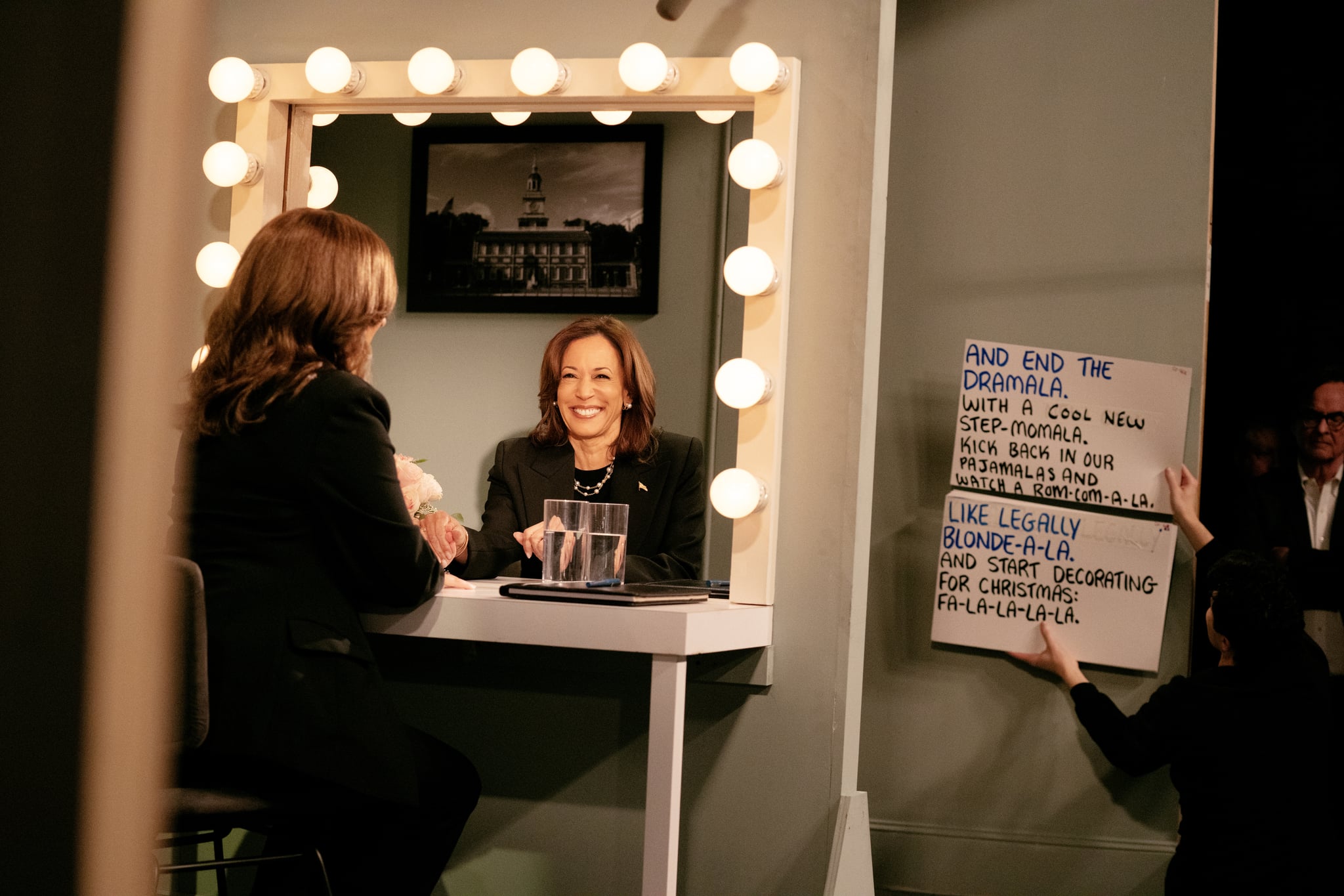 Maya Rudolph and Kamala Harris look into mirrors during a Saturday Night Live episode.