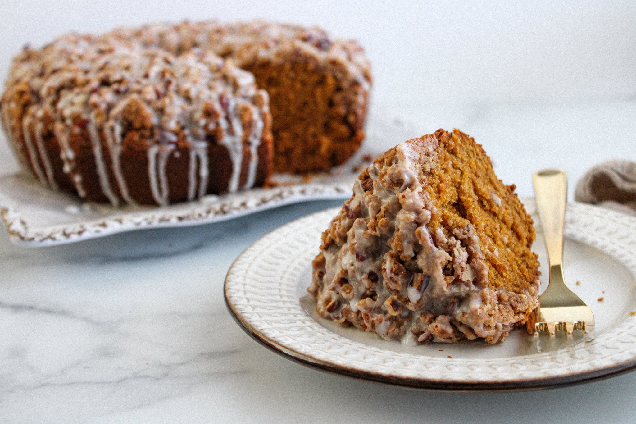 pumpkin crumb cake: finished recipe with cake slice on a plate