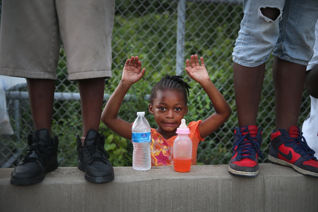 A child put her hands up in protest of the killing of Michael Brown. A child put her hands up in protest of the killing of Michael Brown.