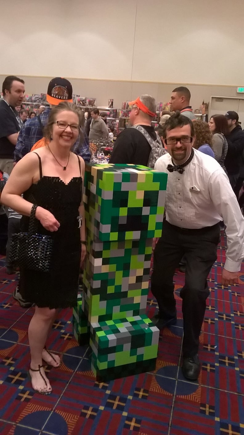 Here's the married couple posing with a Minecraft character.