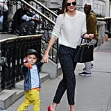 Miranda was spotted with her son, Flynn, while wearing a cozy white sweater paired with printed pants and bright red heels. She accessorized with an ultracovetable Louis Vuitton Capucines bag.