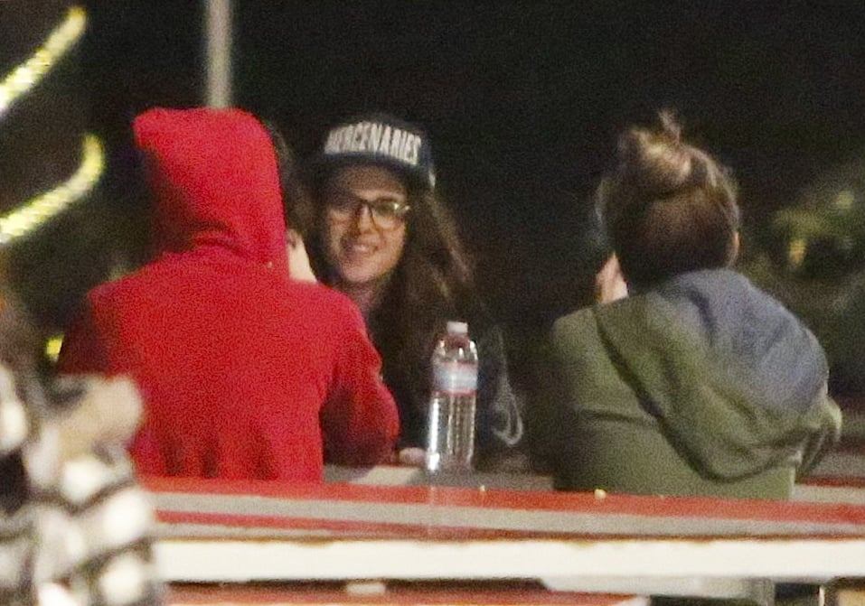 Kristen smiled while grabbing dinner with her friends.