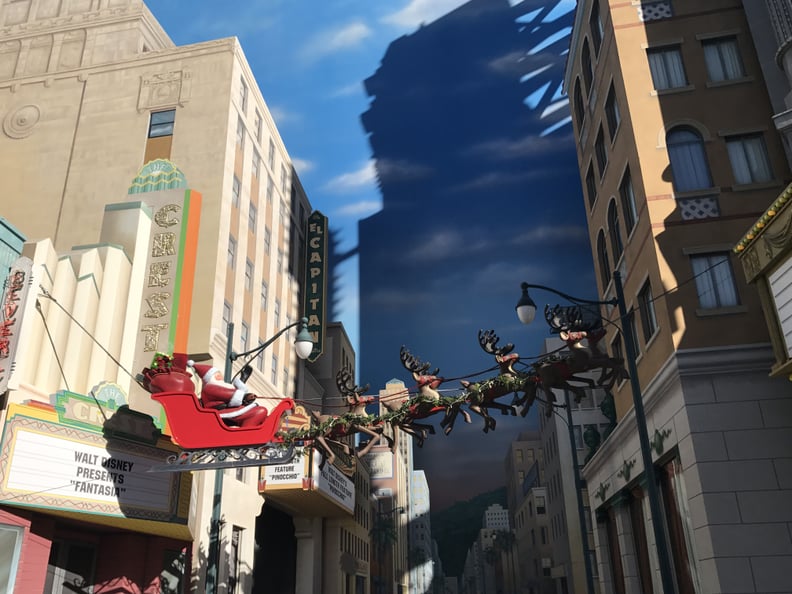 Santa and His Sleigh Sail Over Hollywood, and a 50-Foot Christmas Tree Sits in Carthay Circle on Buena Vista Street.