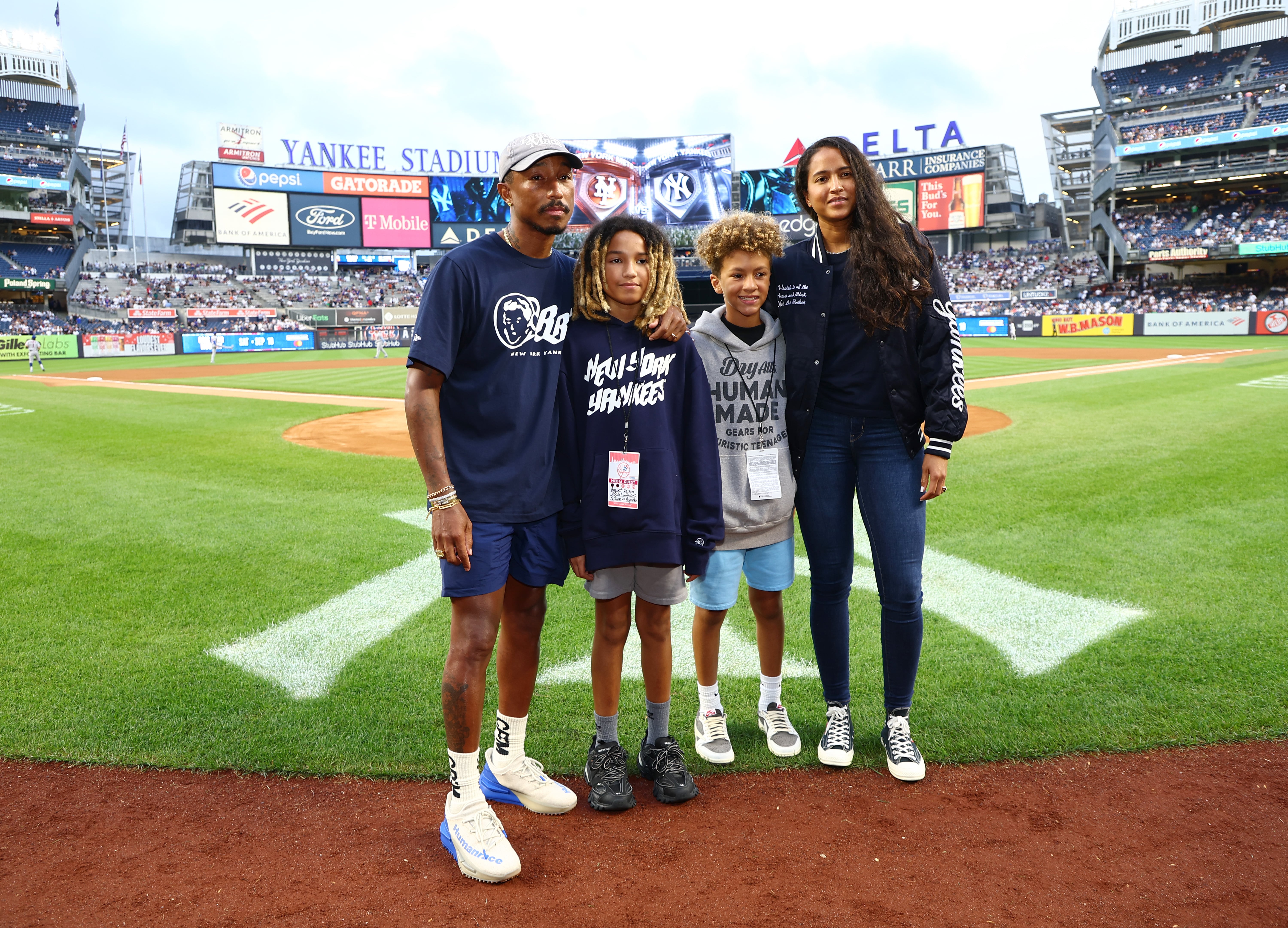 Pharrell and Son Throw First Pitch at New York Yankees Game