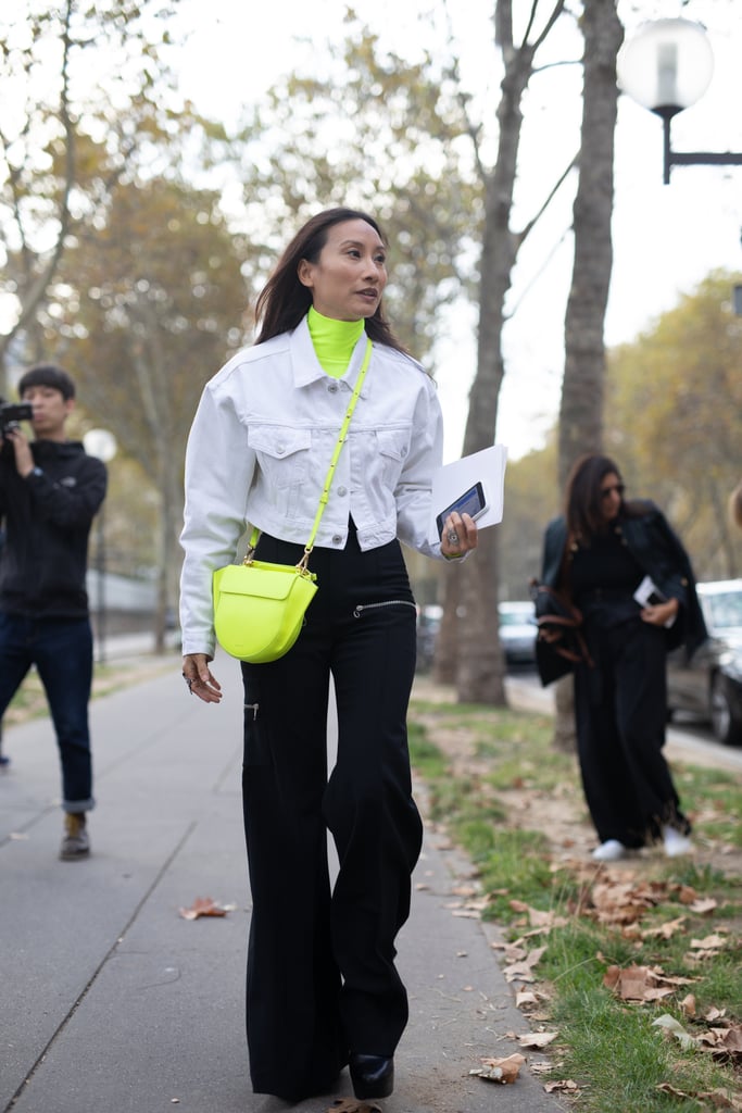 A denim jacket is the perfect way to temper two trends at once, like neon and cargo pants.