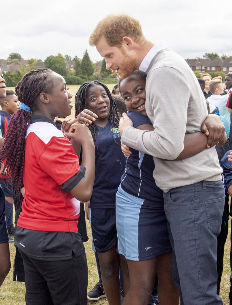 Prince Harry Hugs Kids at Lealands High School