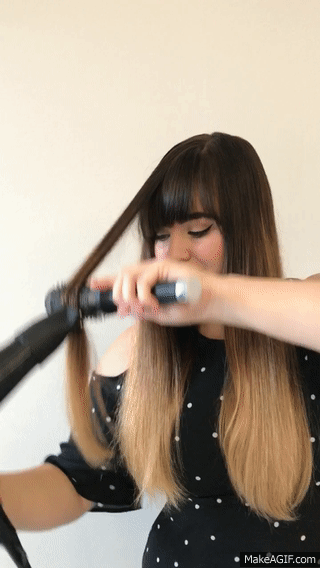 Here's the Nozzle Dazzle in action. It's really easy to maneuver; the rollers glide right over my hair with no trouble at all. When I get to the tips of my hair, I turn my brush under a bit to get smooth ends. I am not a professional stylist in any way and I find using this to be a breeze.
