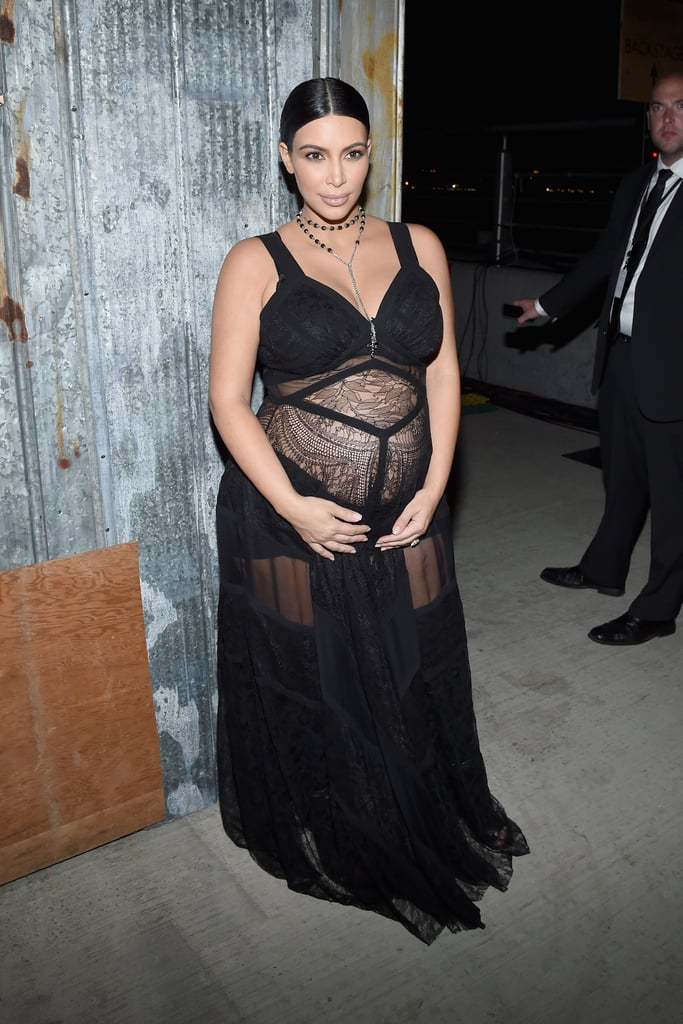 Kim brought her lace-clad baby bump to the front row of Givenchy's runway.
