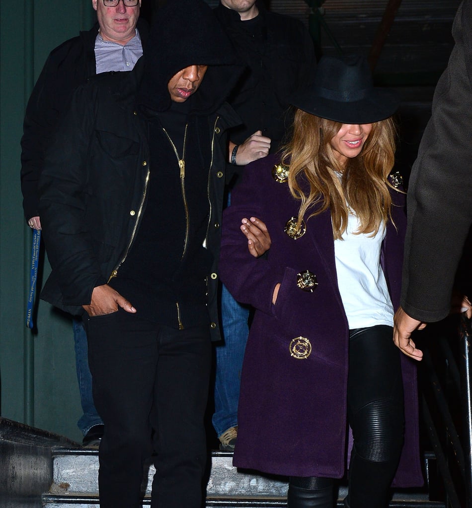 Jay Z held Beyoncé's arm as they left Taylor's building