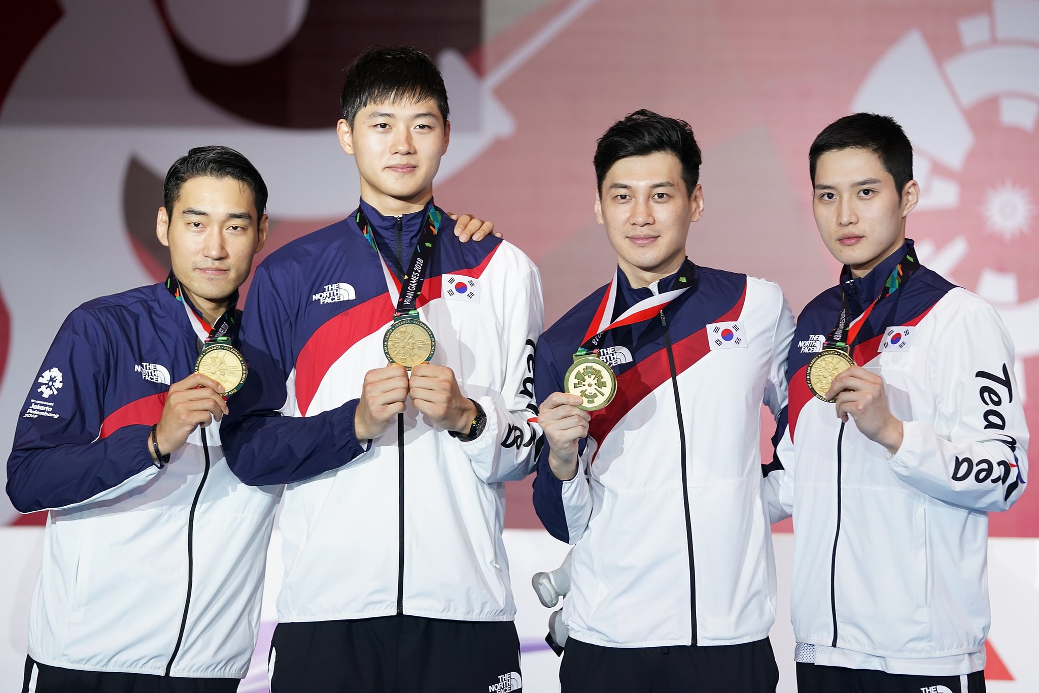 JAKARTA, INDONESIA - AUGUST 23:  Sanguk Oh;  Bongil Gu; Junho Kim and Bongil Gu of Korea pose on the podium during the awards ceremony in Fencing Men's team foil final match on day five of the Asian Games on August 23, 2018 in Jakarta, Indonesia.  (Photo by Lintao Zhang/Getty Images)