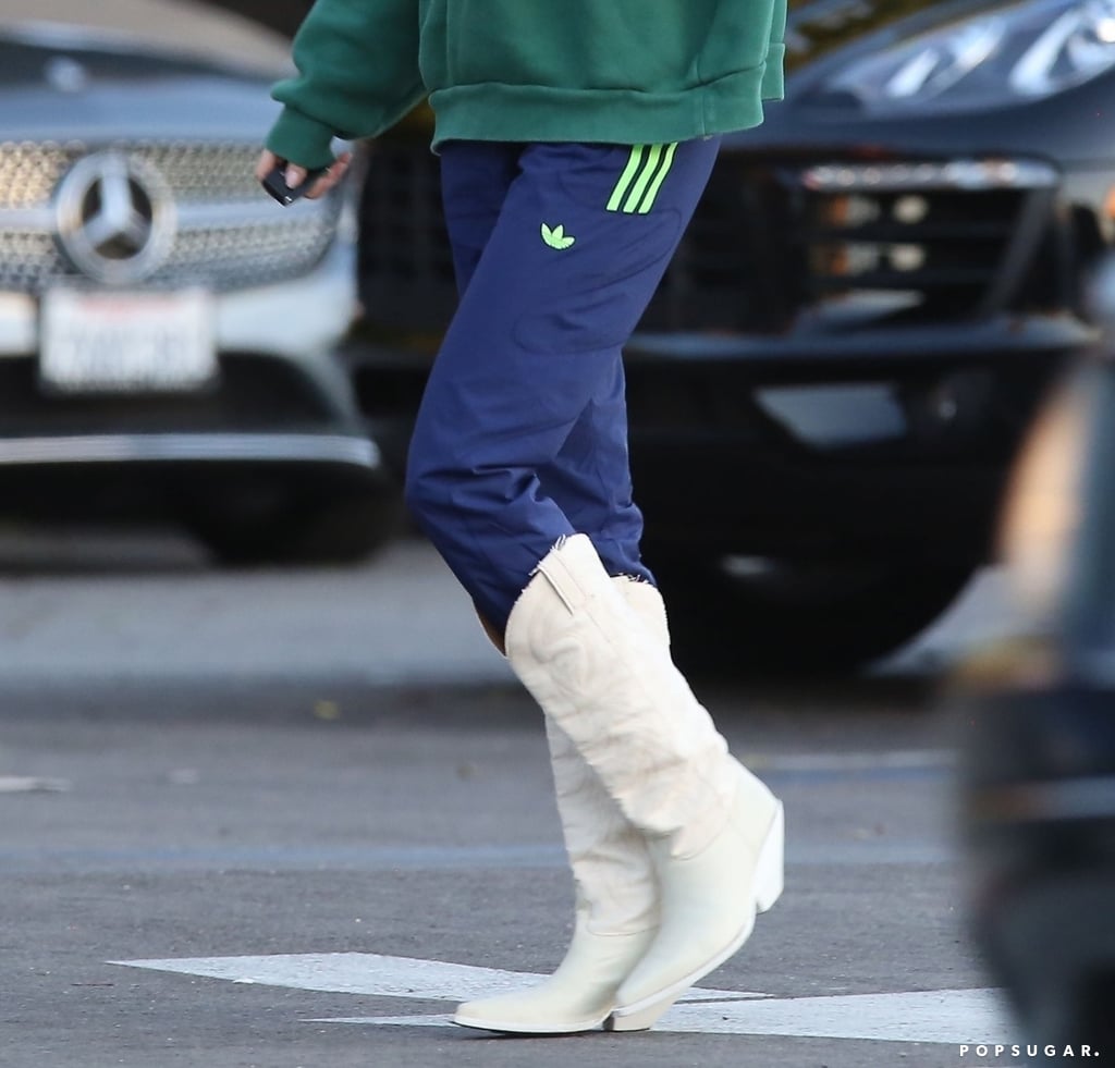 Kendall Jenner White Cowboy Boots and Adidas Track Pants