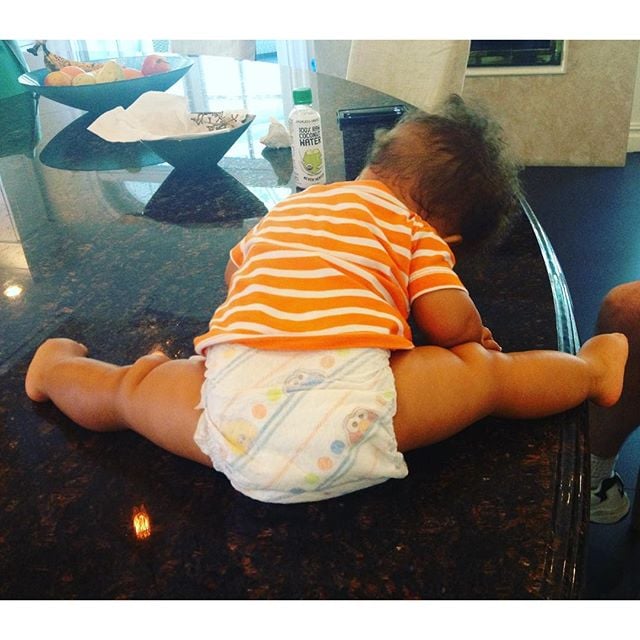 In September 2015, Alicia shared this gem of Genesis, writing, "Baby yoga-time!! Something to make you smile!!"