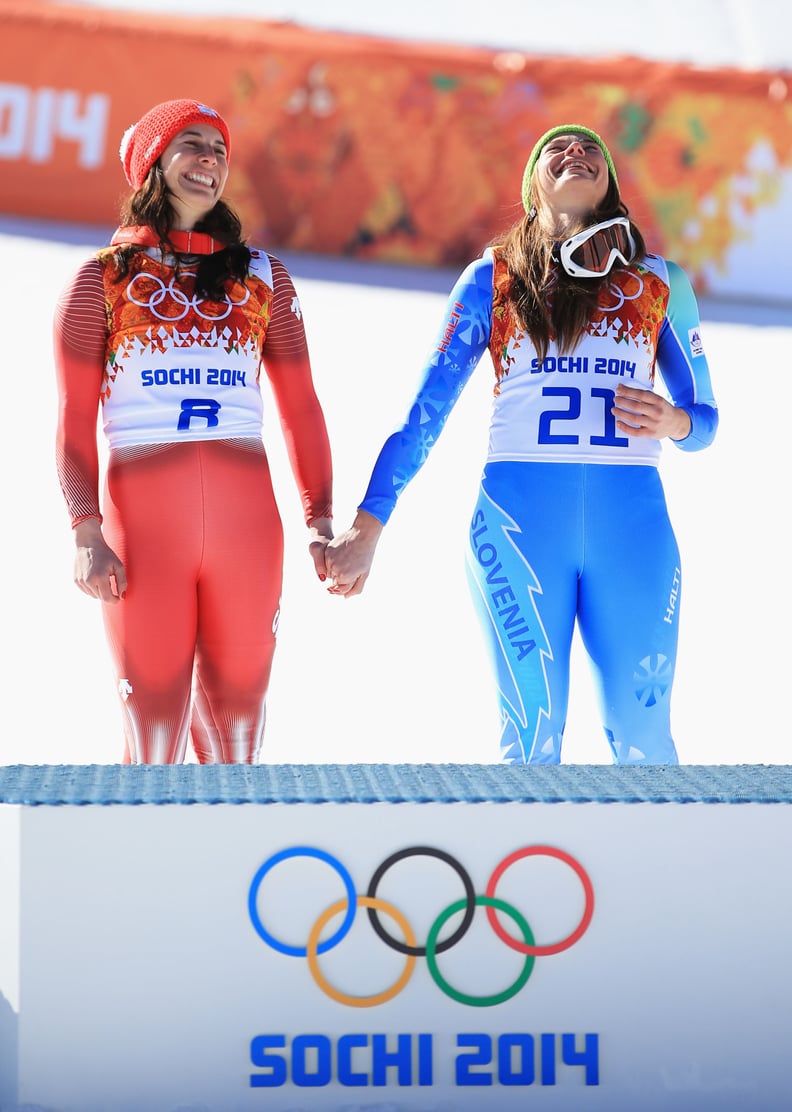 The women held hands at the podium, all smiles.