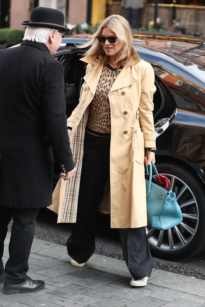 She wore a leopard print top with wide-leg black trousers and a trench coat in November 2016.