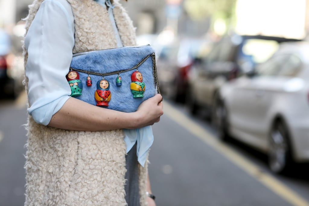 This clutch comes decked out with little figurines.