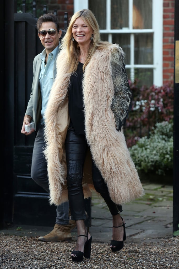 The model was all smiles as she left her home in London.