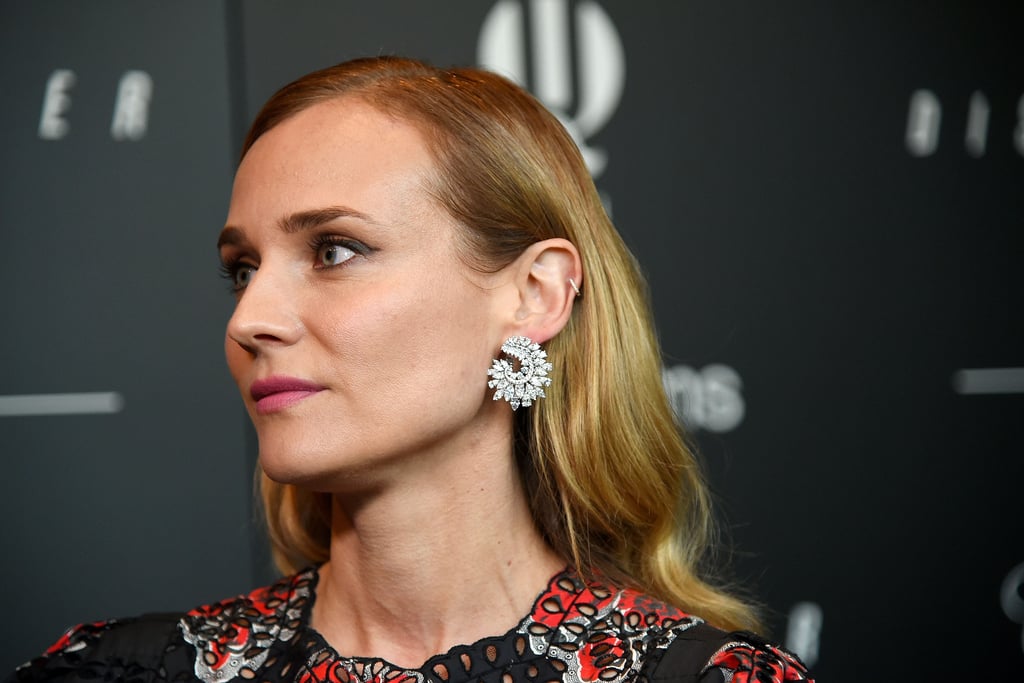 She accessorized with a pair of Chopard hoop earrings.