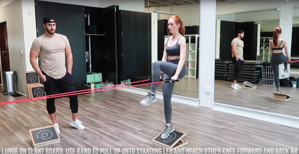 Upper body is next! With one foot on a slant board, grab some resistance bands by the handles, and use them to pull up onto your standing leg while reaching your other knee forward and back.