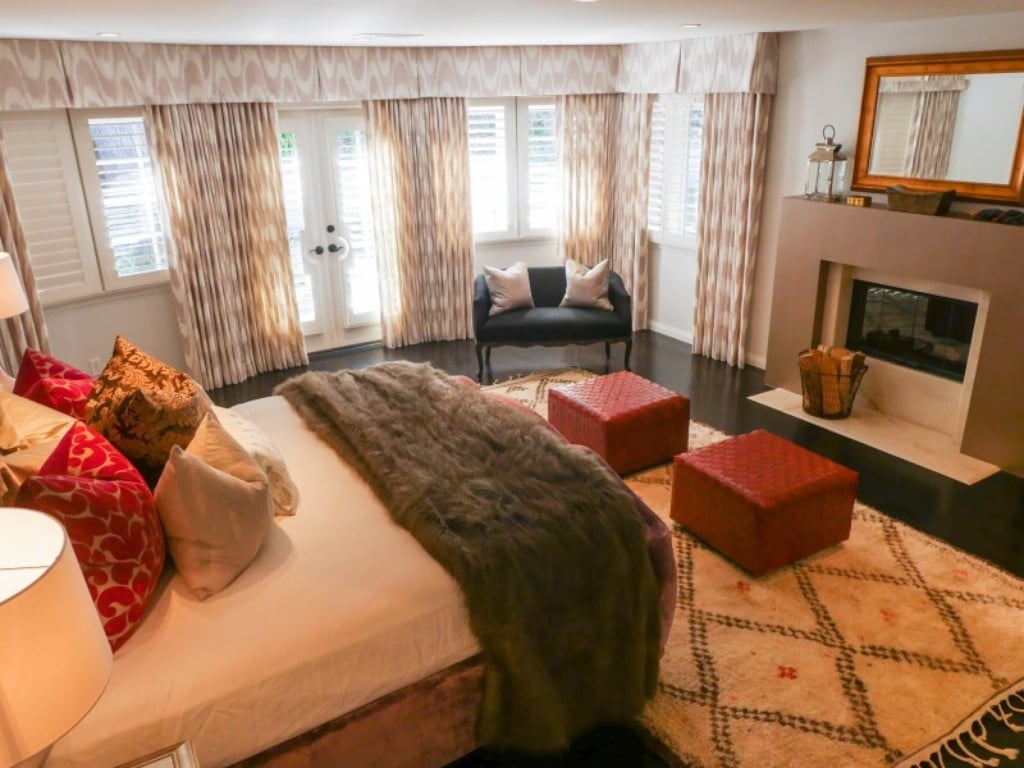 The bedroom's warm touches like the fireplace make it a cozy mainstay. 
Source: Sotheby's Realty
