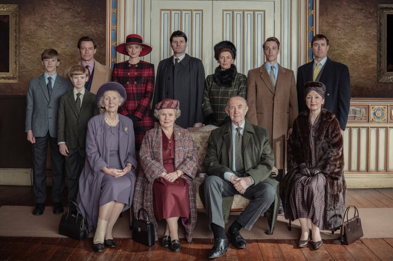 THE CROWN, standing: Senan West as Prince William (left), Will Powell as Prince Harry (2nd from left), Dominic West as Prince Charles (3rd from left), Elizabeth Debicki as Diana Princess of Wales (4th from left); sitting: Imelda Staunton as Queen Elizabet