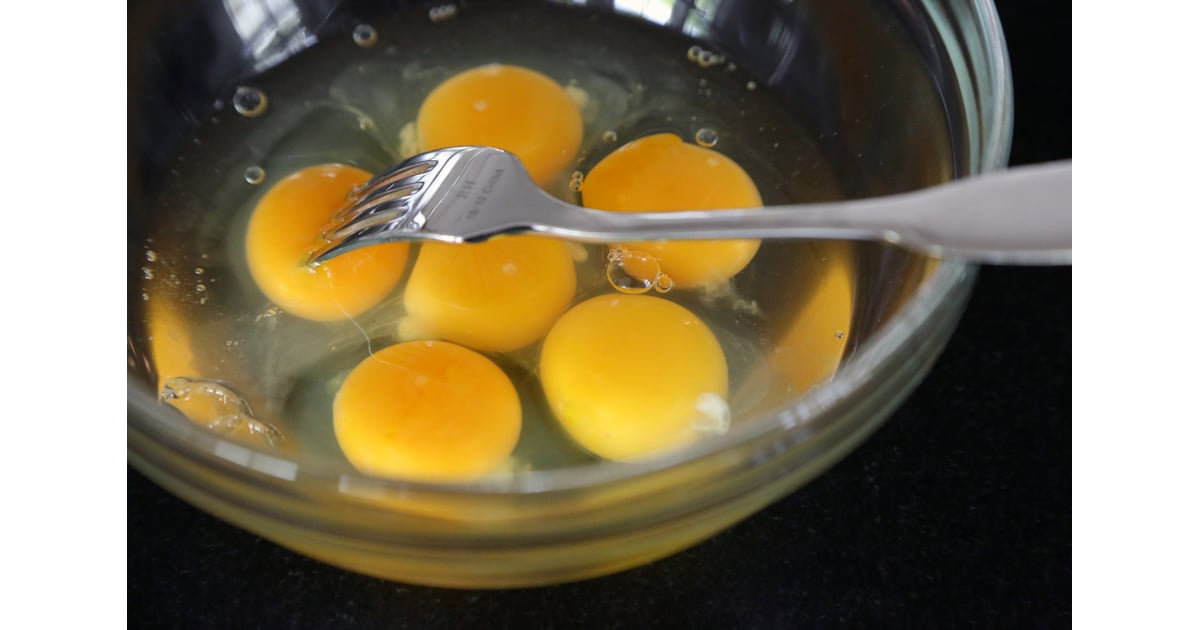 Use a Fork to Poke Each Egg Yoke The Right Way to Scramble Eggs POPSUGAR Food Photo 4
