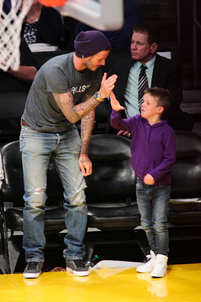 David Beckham gave his son Cruz an adorable high five as they watched the Lakers play together in April 2012.