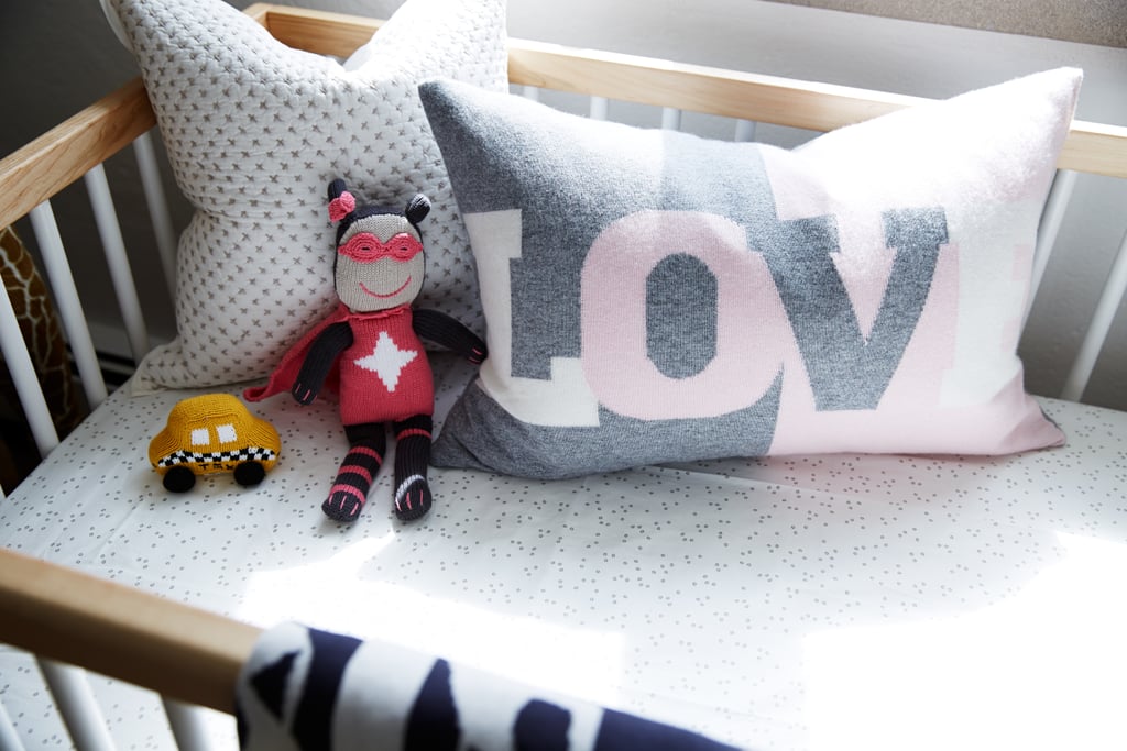 A gray-and-pink graphic pillow picks up on the Pop art in the rest of the house. As for the toys, Coco says she "doesn't want to get into gender rules so much. I don't think that cars are only for the boys!"