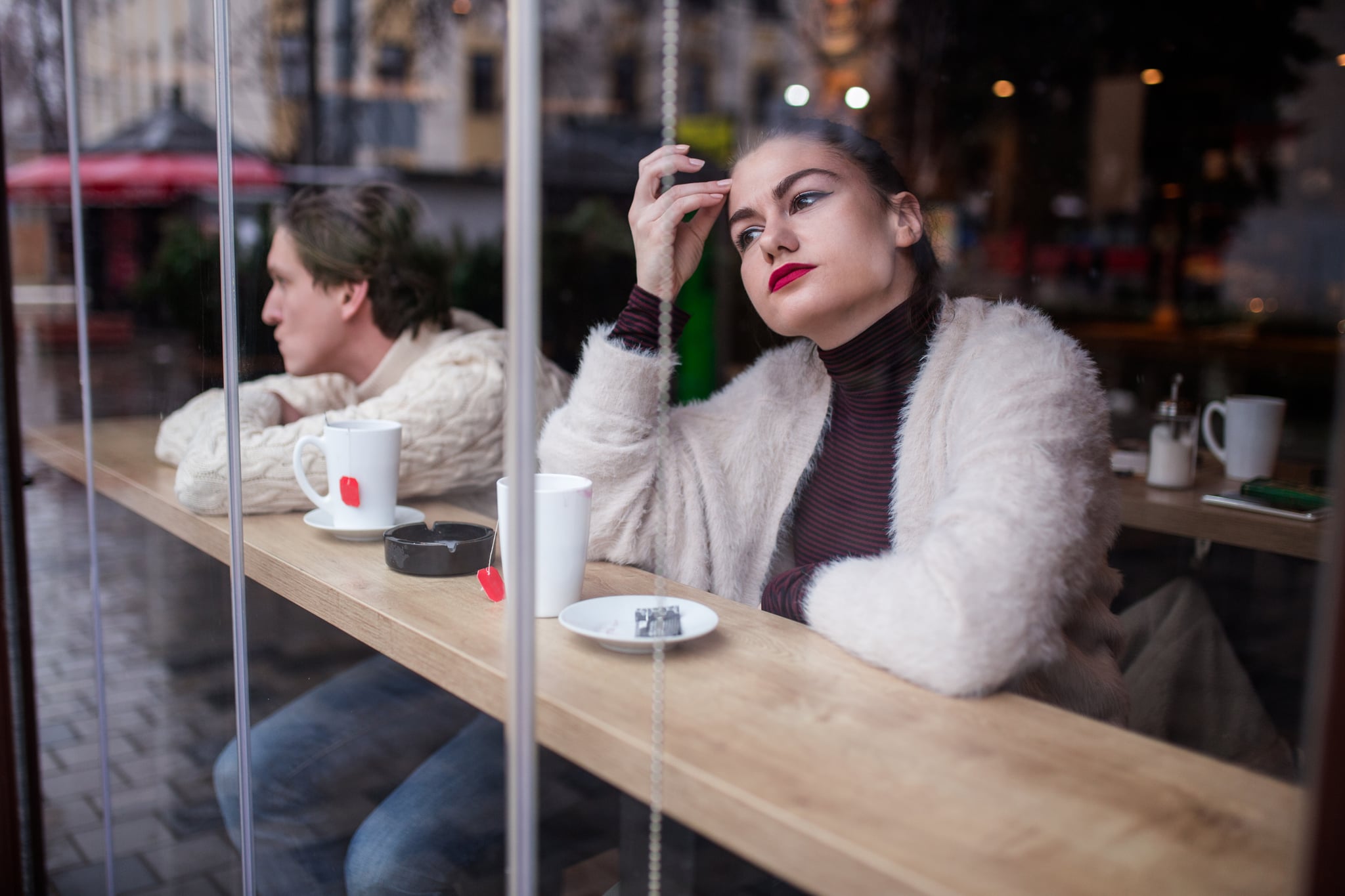 Young Couple Breaking Up In Cafe