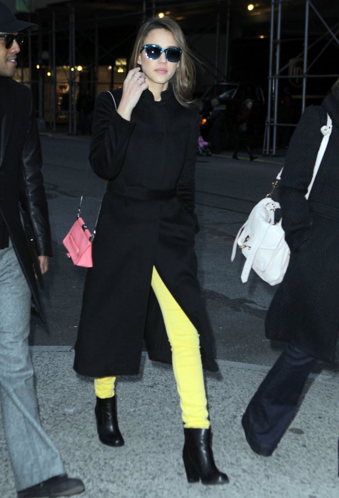 Style so bright, she has to wear shades. While out and about in New York, Jessica paired her black separates with daffodil yellow denim and a pink Loewe bag.