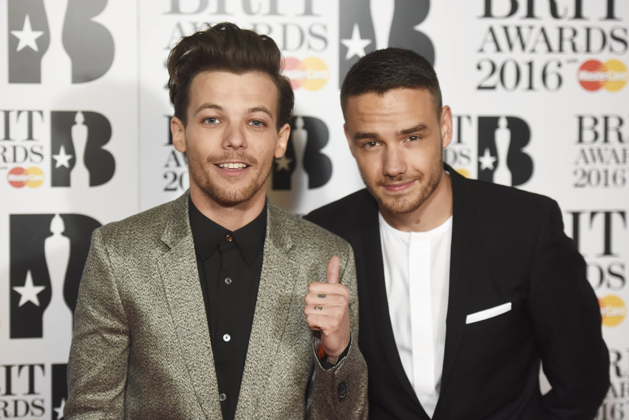 LONDON, ENGLAND - FEBRUARY 24: (EDITORIAL USE ONLY)  Louis Tomlinson (L) and Liam Payne attend the BRIT Awards 2016 at The O2 Arena on February 24, 2016 in London, England.  (Photo by Dave J Hogan/Dave J Hogan/Getty Images)