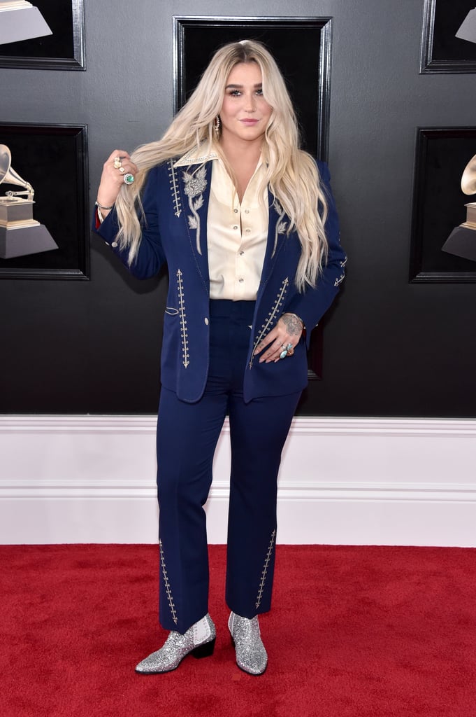 There were plenty of gorgeous gowns at the Grammy Awards on Sunday, but it was suits that truly ruled the red carpet. Kesha showed up in a blue Western-inspired set with a silky button-down blouse. Her pants and jacket have beautifully embroidered detailing and a great fit. As much as we love it, it's the singer's boots we need ASAP. Her glittery shoes sparkled with every step and, to be honest, we want to rock these kicks everyday until the end of time. Make sure to check out every angle of Kesha's cool-girl look.