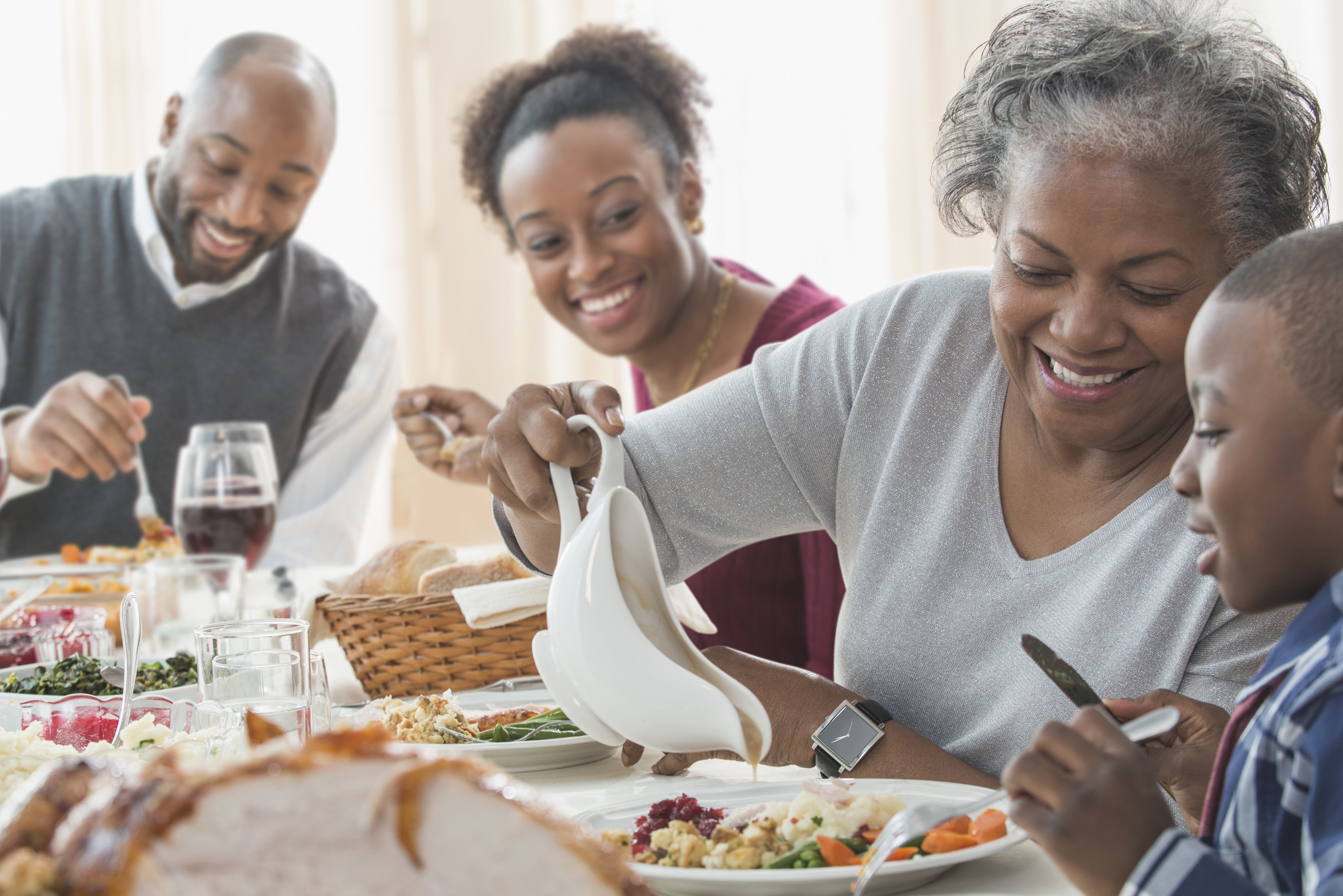 Does your mum cook dinner. Black Family. Family dinner. Black Family eating. African Family.