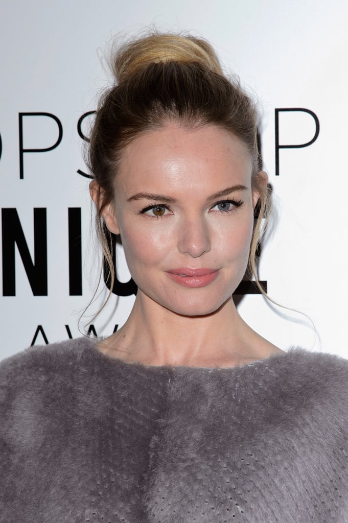 You'll want to copy Kate Bosworth's flat and circular topknot with a few pieces hanging just around the ears.