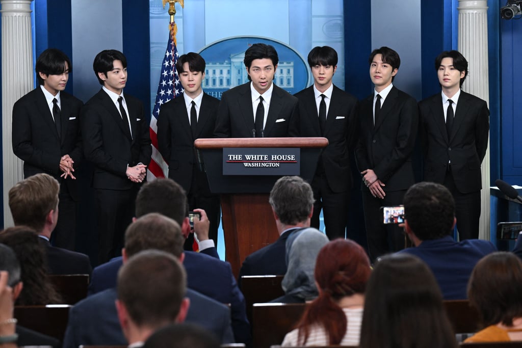 BTS just hit yet another significant career milestone. The seven members of the massively successful K-pop group — Jin, Jimin, J-Hope, Jungkook, RM, Suga, and V — visited the White House on May 31 to discuss inclusion, representation, and rising anti-Asian hate crimes in the nation. The band joined White House Press Secretary Karine Jean-Pierre at a press briefing before attending a closed meeting with President Joe Biden. 
"It is a great honor to be invited to the White House today to discuss the important issues of anti-Asian hate crimes, Asian inclusion, and diversity," RM said during the briefing. "We thank President Biden and the White House for giving this important opportunity to speak about the important causes [and] remind ourselves of what we can do as artists."
Jungkook continued, "We still feel surprised that music created by South Korean artists reaches so many people around the world, transcending languages and cultural barriers. We believe music is always an amazing and wonderful unifier of all things." Meanwhile, V added, "We hope today is one step forward to respecting and understanding each and every one as a valuable person."
The visit comes one year after Biden signed the COVID-19 Hate Crimes Act addressing increased violence against Asian Americans largely sparked by disinformation about the pandemic. "President Biden and BTS will also discuss the importance of diversity and inclusion and BTS's platform as youth ambassadors who spread a message of hope and positivity across the world," the White House previously stated in a press release. 
This isn't the group's first political endeavor: BTS appeared at the United Nations General Assembly in New York City last year to deliver remarks on how the pandemic and climate change affect young people. They also performed "Permission to Dance" in a video filmed at the headquarters. Prior to that, they attended the General Assembly in 2018 for the launch of the Generation Unlimited initiative. 
Their meeting comes weeks after Selena Gomez hosted the first Mental Health Youth Action Forum, held at the White House, which brought together First Lady Jill Biden, Surgeon General Vivek Murthy, and various other leaders in government and mental health advocacy. "Bringing attention to mental health through media or just talking about your own journeys can help," Gomez said at the event. "It sets the example that it's a topic that can and should be discussed freely and without shame."

    Related:

            
            
                                    
                            

            RE:PRESENT