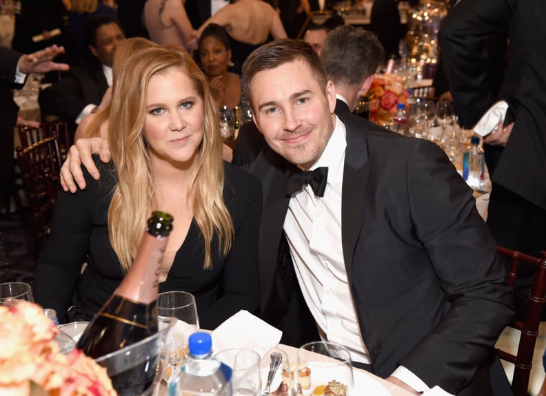 Amy Schumer and Ben Hanisch stuck close at their table.