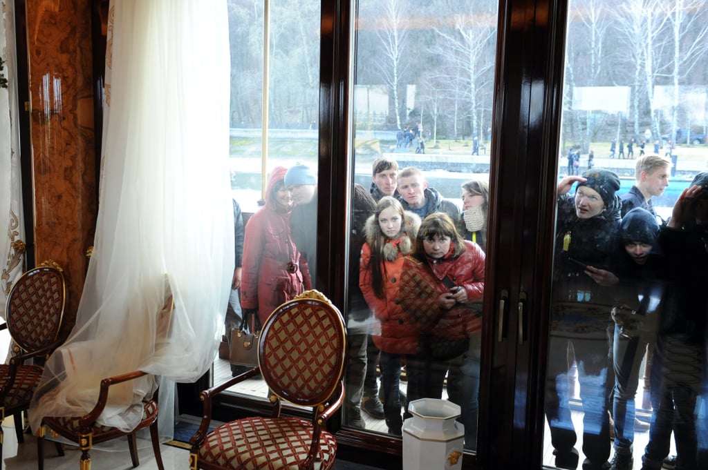 Members of the public looked through the house's windows to see inside.