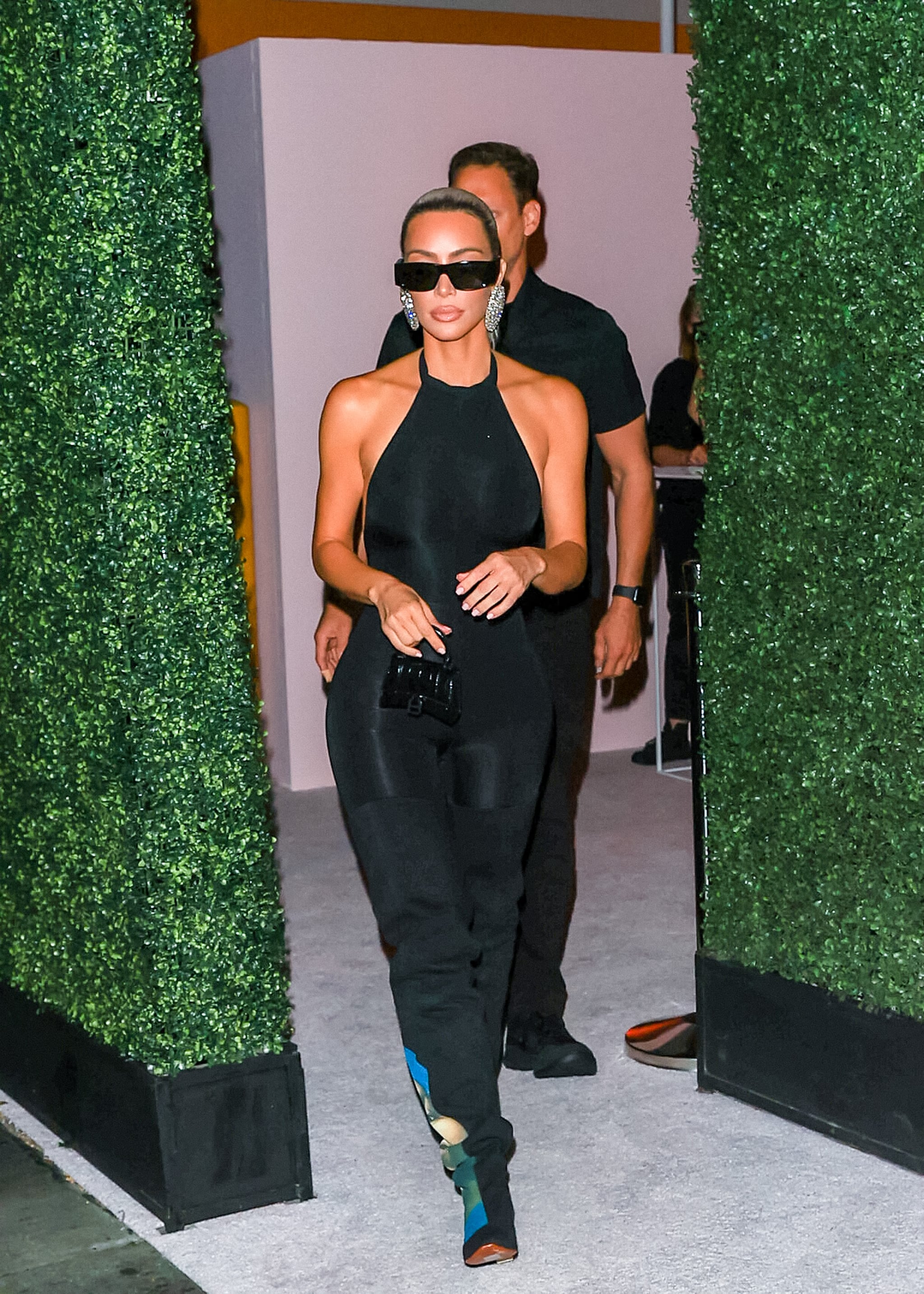Kim Kardashian's Black Jumpsuit and Thigh-High Boots Photos | POPSUGAR  Fashion