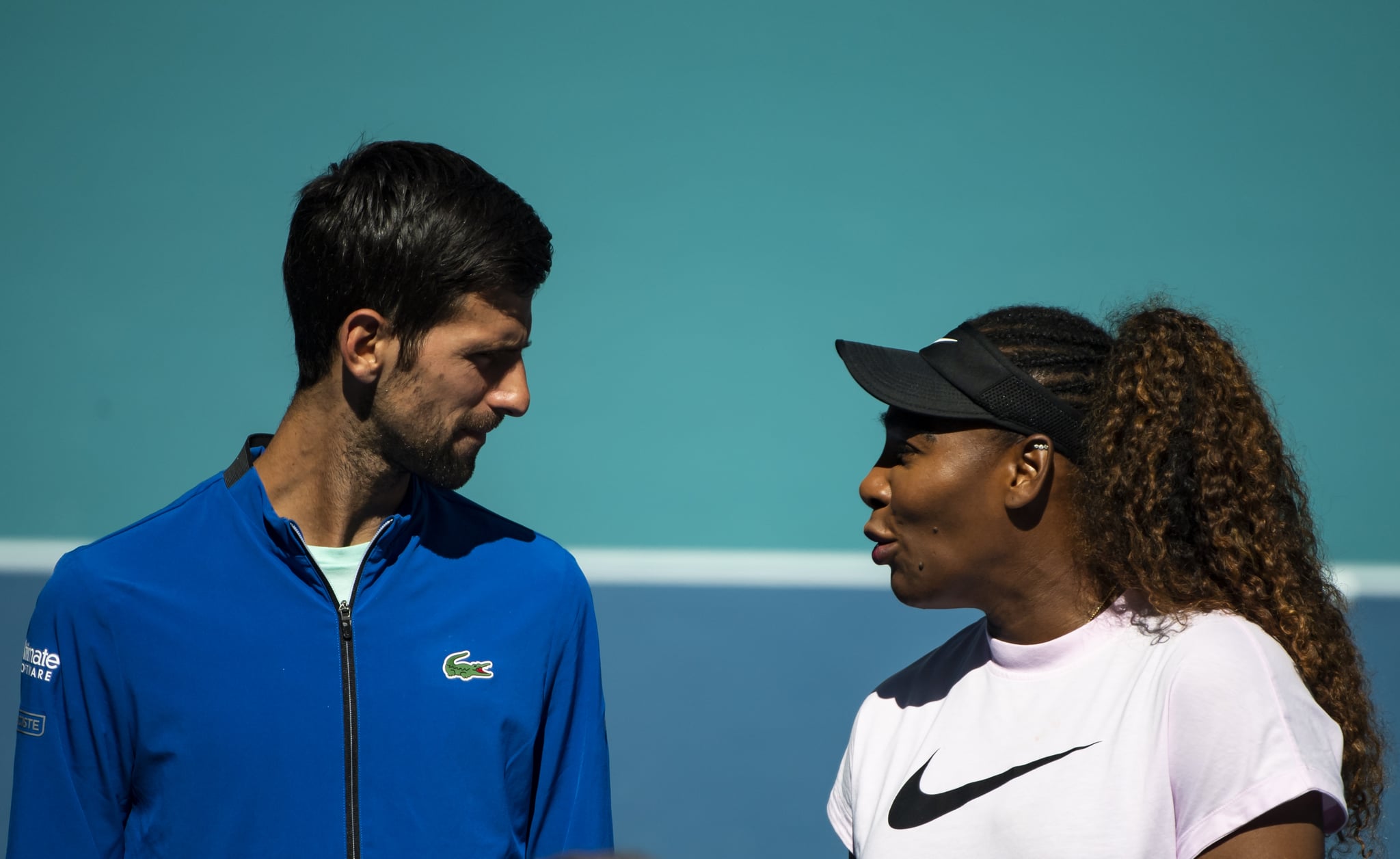 MIAMI GARDENS, FLORIDA - MARCH 20: (L-R) Novak Djokovic of Serbia and Serena Williams of the United States talk during the ribbon cutting ceremony on the new Stadium Court at the Hard Rock Stadium, before the first match of the Miami Open on March 20, 2019 in Miami Gardens, Florida. (Photo by TPN/Getty Images)