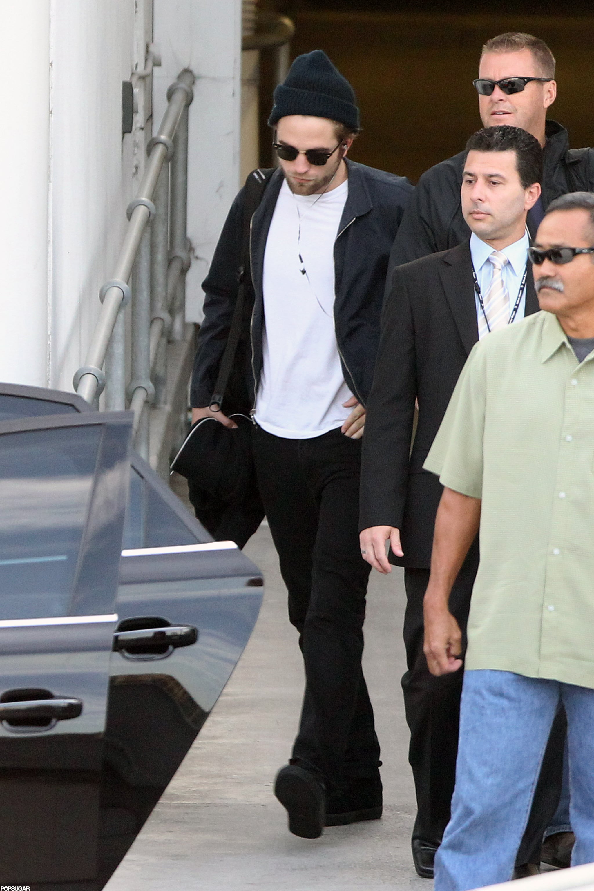 Robert Pattinson wore a black hat and 