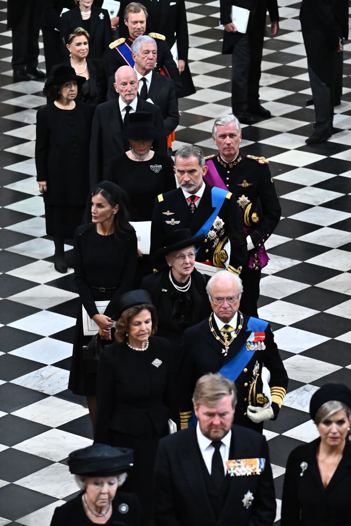Queen Letizia wears a Carolina Herrera dress as she walks beside King Felipe VI.