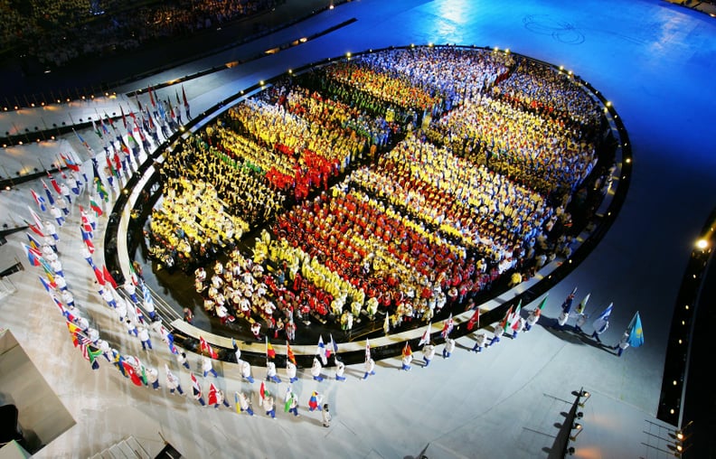 Meanwhile, the athletes were lined up in a perfect, colorful oval.