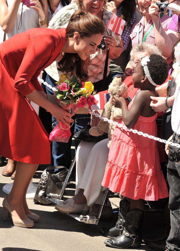 During a royal visit to Canada in July 2011, Kate knelt down to accept a bouquet from a young girl.